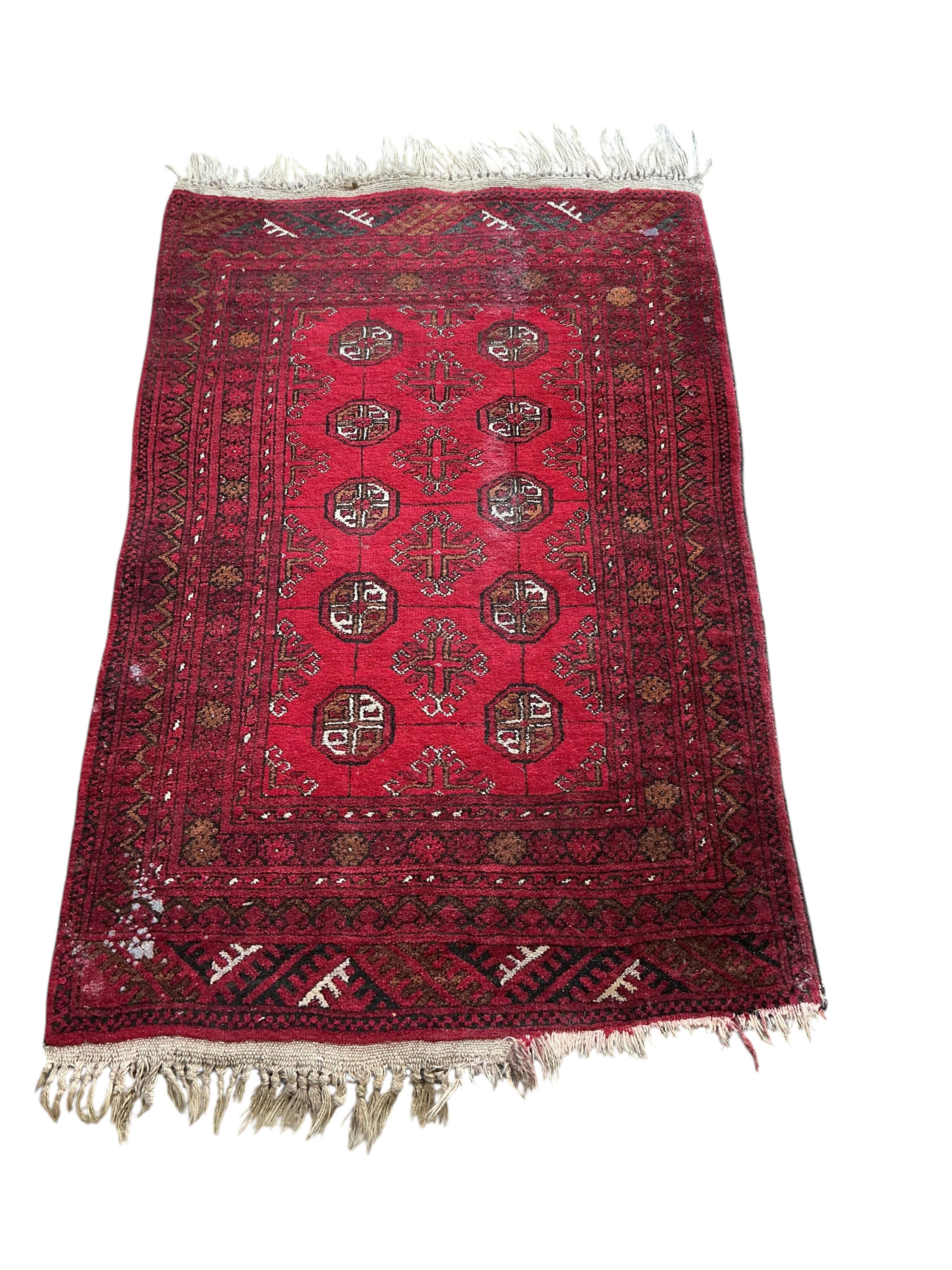 A Hamadan red ground rug, 176 x 128cm together with a smaller Bokhara mat